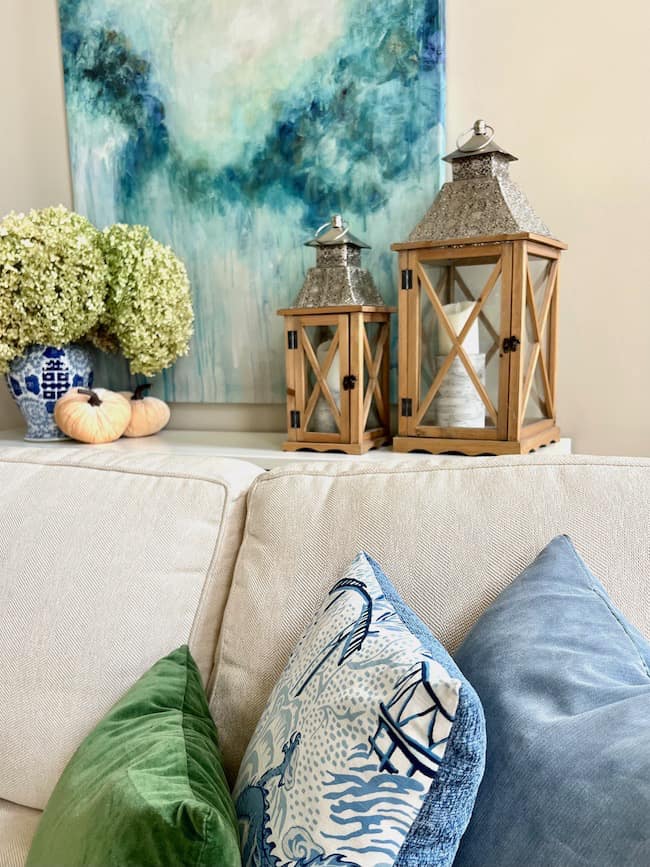 Sofa Table with Wooden Lanterns and Dried Green Hydrangeas in Blue and white ginger jar vase.