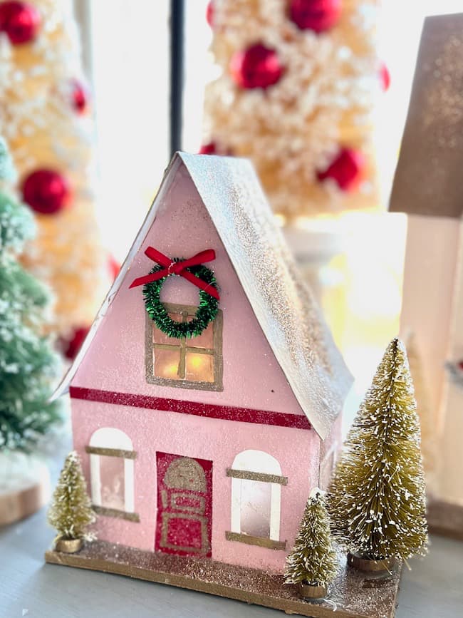 Pink, red, and gold DIY Christmas Putz house