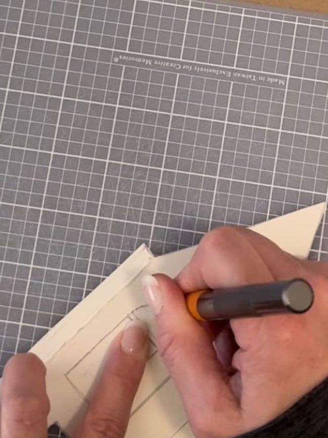 Use an X-acto knife to cut out the window designs.