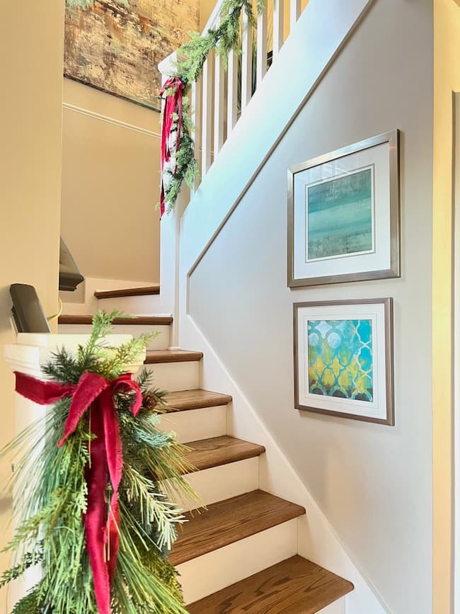 Stairwell and banisters with greenery and bows for Christmas