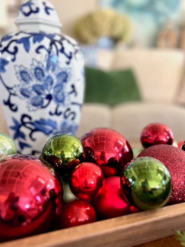 Christmas balls in dough bowl and blue and white ginger jar