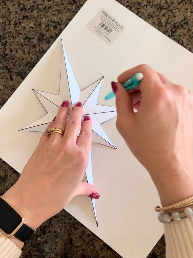 Trace the star pattern onto the back of the glitter paper.