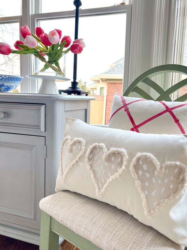 DIY Valentine Pillow with neutral antelope print hearts.