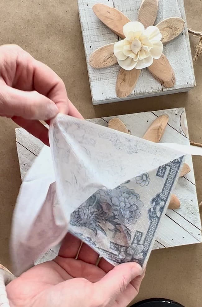 Separate the layers of the paper napkin