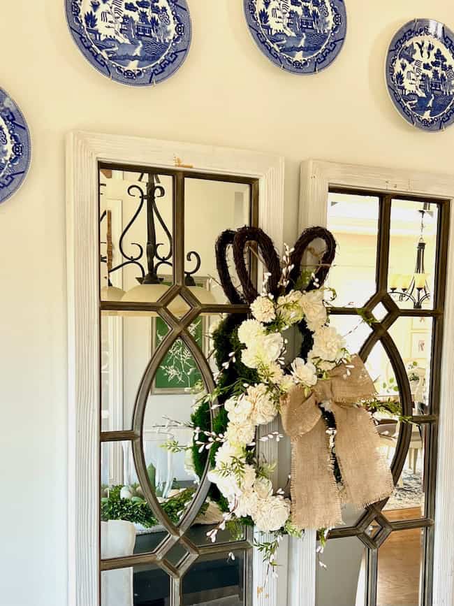 Bunny Easter Wreath hangin on mirrors with blue and white plate display
