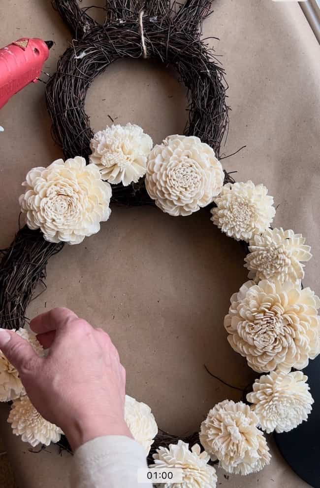 Add wood flowers to your DIY bunny wreath