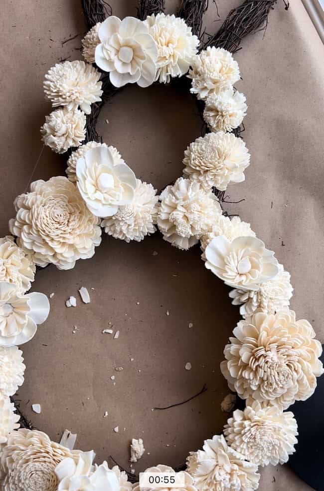 Add wood flowers to your bunny wreath