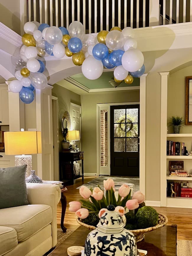 Ideas for a Bridal Shower Brunch -- Create a balloon garland with blue, white, and gold balloons.