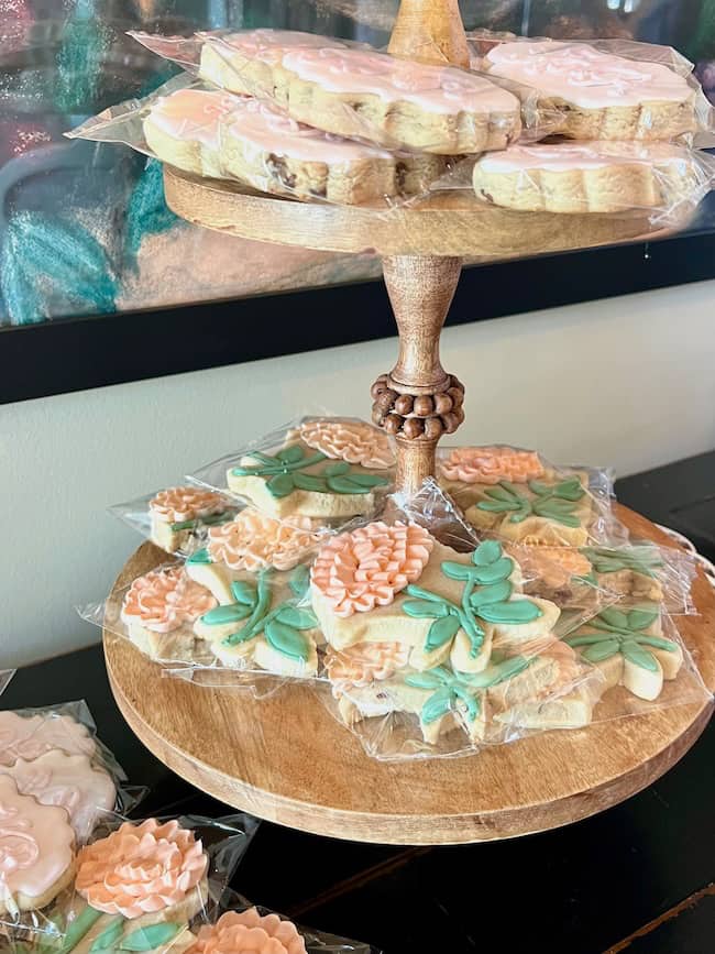 Flower cookies on a wooden tiered stand