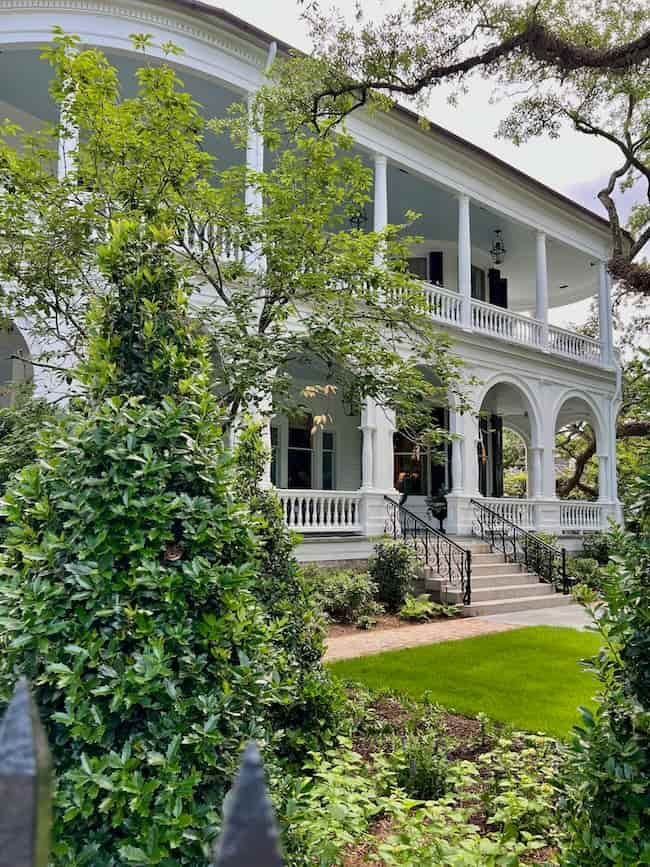 Historic home in Charleston with double white column porch.