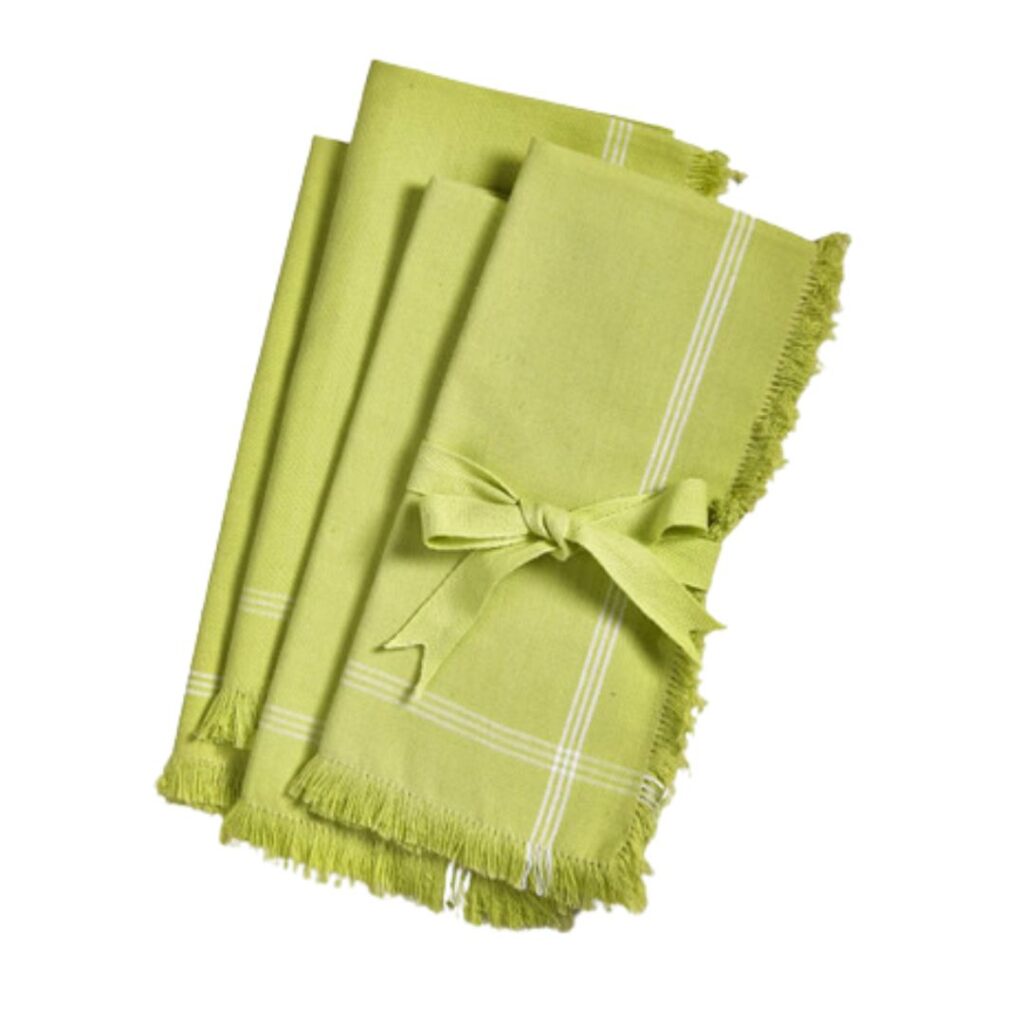 A set of lime green cloth napkins with white stripes and fringed edges, neatly folded and tied together with a matching ribbon, perfect for setting a pretty summer table. The napkins are arranged on a white background.