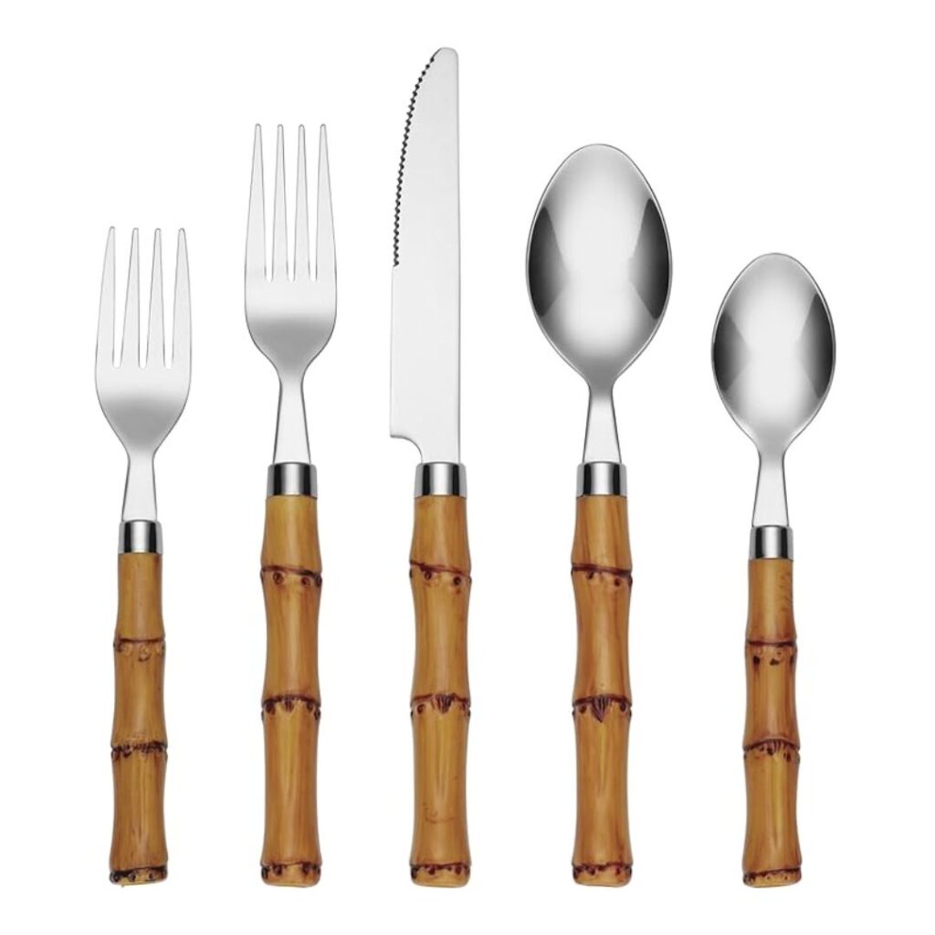 Set a pretty summer table with this set of five stainless steel utensils featuring bamboo-style handles. The set includes a dinner fork, salad fork, serrated dinner knife, dinner spoon, and teaspoon. The tan-colored handles have a textured design that beautifully resembles bamboo stems.