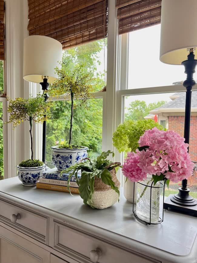 Decorate with topiaries on the kitchen buffet with fresh cut hydrangeas.