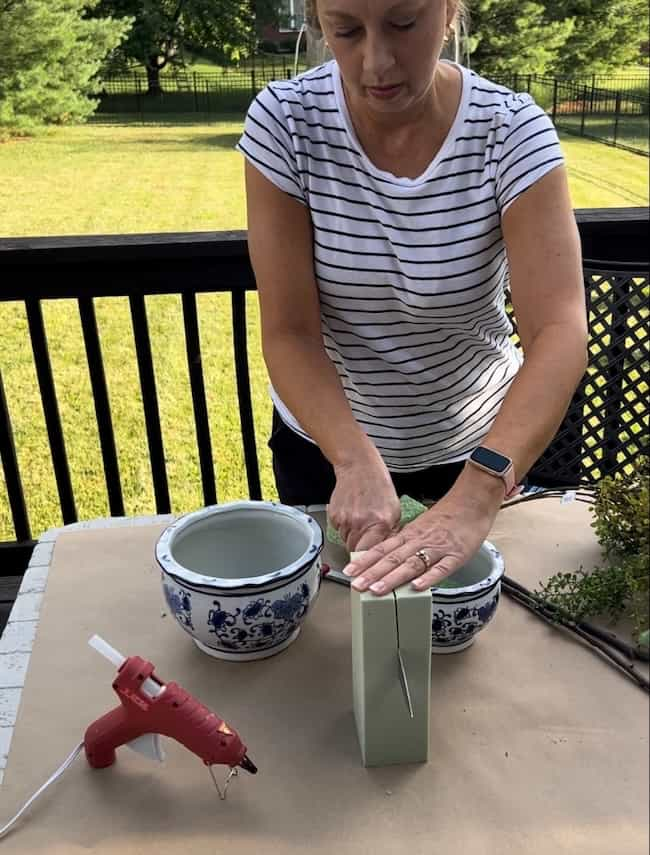 Cut the floral foam to fit the pots