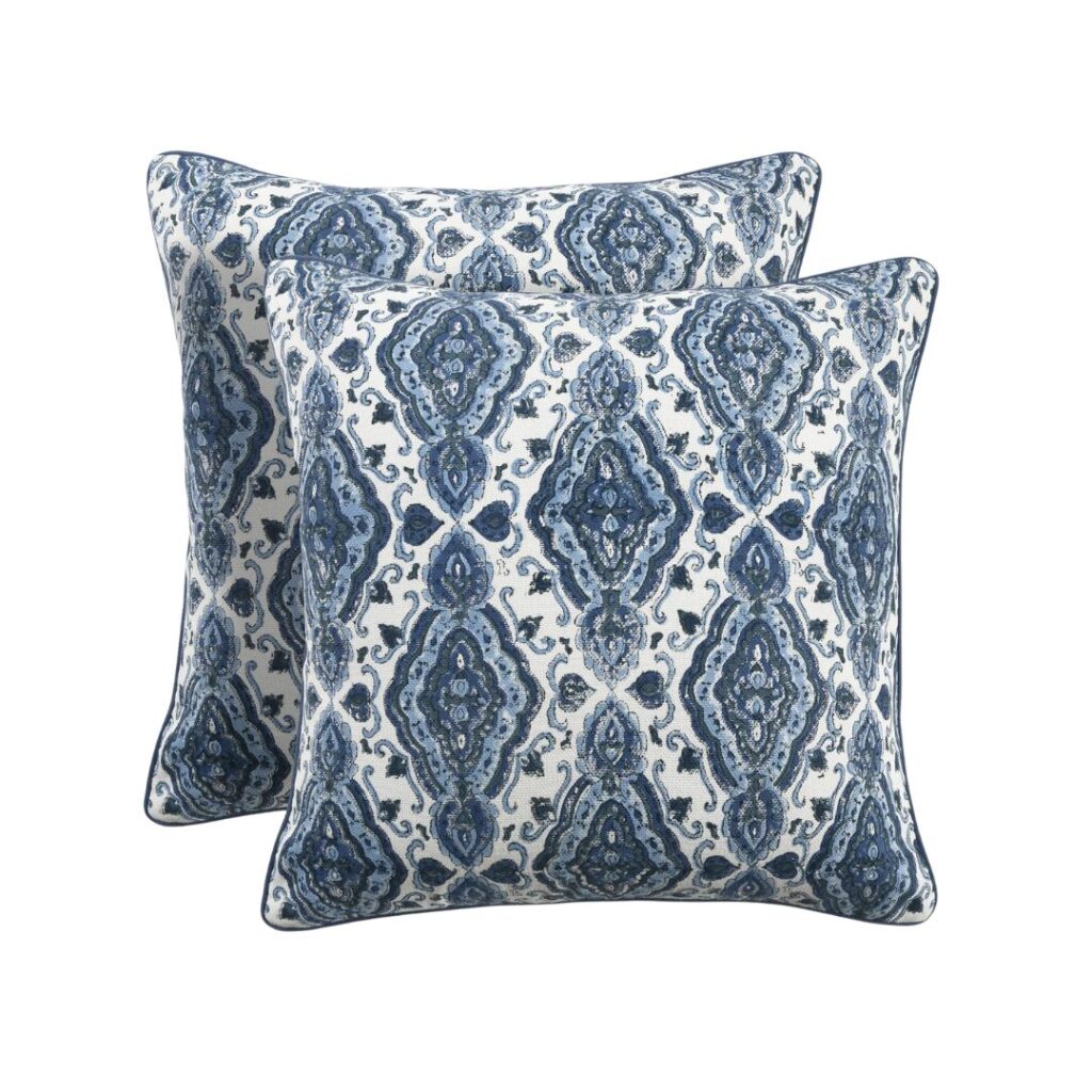 Two decorative throw pillows with a blue and green damask pattern, featuring intricate, symmetrical designs. These budget-friendly block print pillows are placed slightly overlapping each other, showcasing their similar design and pattern.