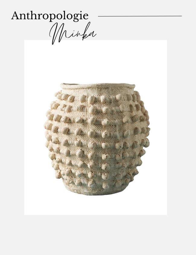 A textured, beige ceramic vase with a rounded shape and raised, spherical patterns covering the surface. The vase is displayed on a plain, light-colored background with the text "Anthropologie Minka" written at the top. It pairs beautifully with our jute twine vase tutorial for a rustic look.