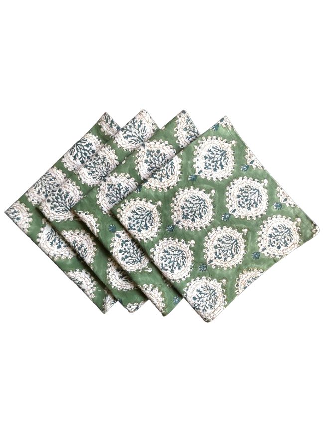 A set of four folded green napkins featuring a white and blue floral mandala pattern, perfect for end-of-summer decorating ideas with hydrangea-inspired colors. The napkins are arranged in a fan-like display against a white background.