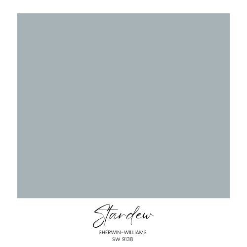 A square color swatch labeled "Stardew" by Sherwin-Williams, with the code SW 9138. The color is a muted, cool-toned shade of blue-gray, perfect for cozy living room decor. Presented on a white background, the text is centered below the swatch.