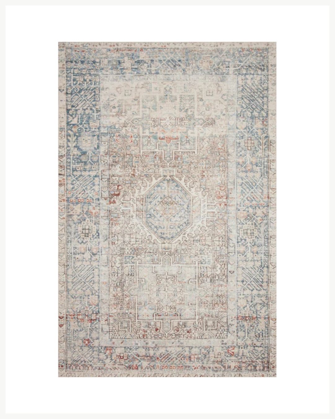 A rectangular, intricately patterned area rug with a faded antique look. The design features geometric shapes and decorative motifs in shades of blue, beige, and red, creating a cozy living room decor aesthetic. The rug has a detailed central medallion and bordered edges to warm up your space.