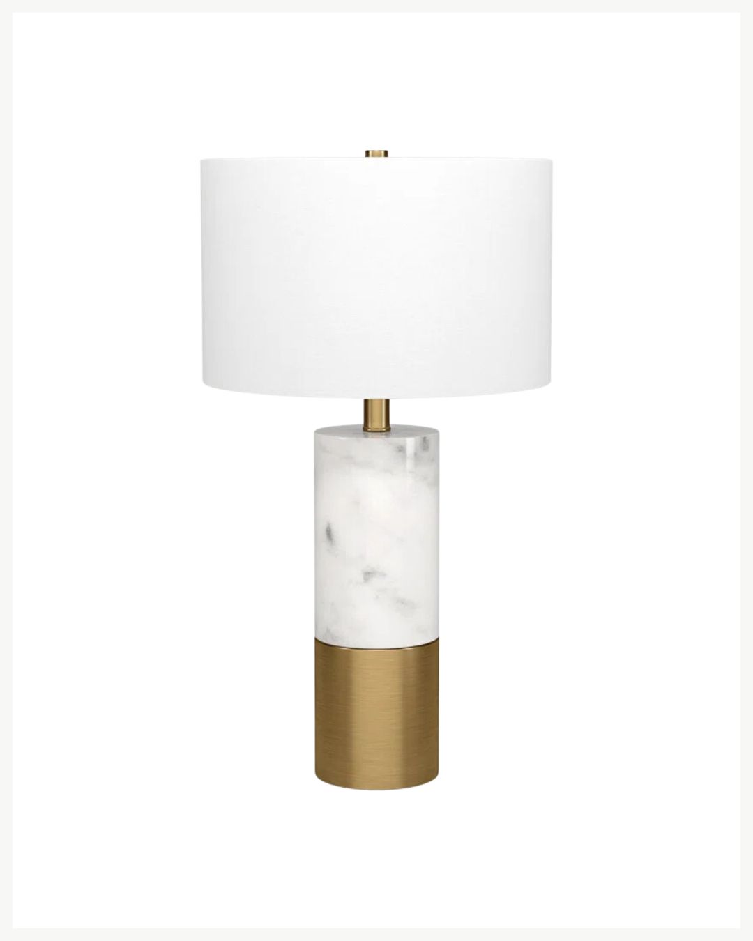 A modern table lamp with a cylindrical base, perfect to warm up your space. The base features a white marble upper section and a metallic gold lower section. The lamp has a white drum-shaped shade and a gold finial at the top, ideal for cozy living room decor.