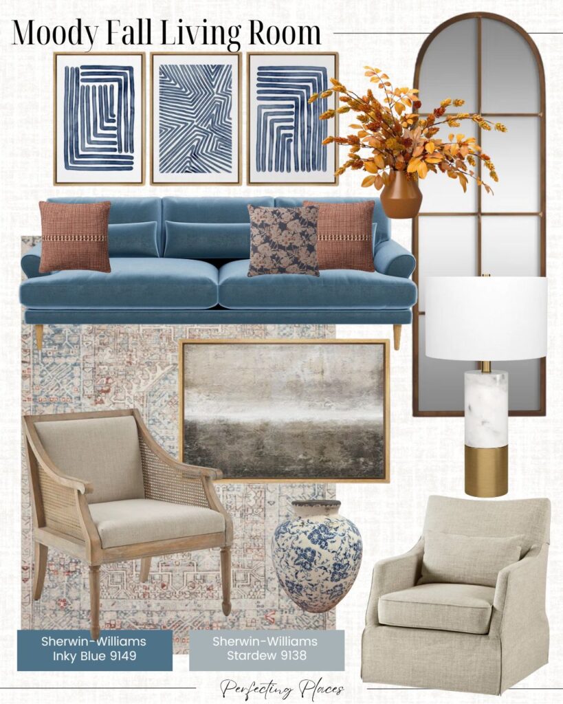 Mood board of a moody fall living room featuring cozy living room decor ideas like a blue velvet sofa, patterned throw pillows, abstract wall art, a beige armchair, neutral armchair, vase, lamp, fall-themed floral arrangement, and large mirror.