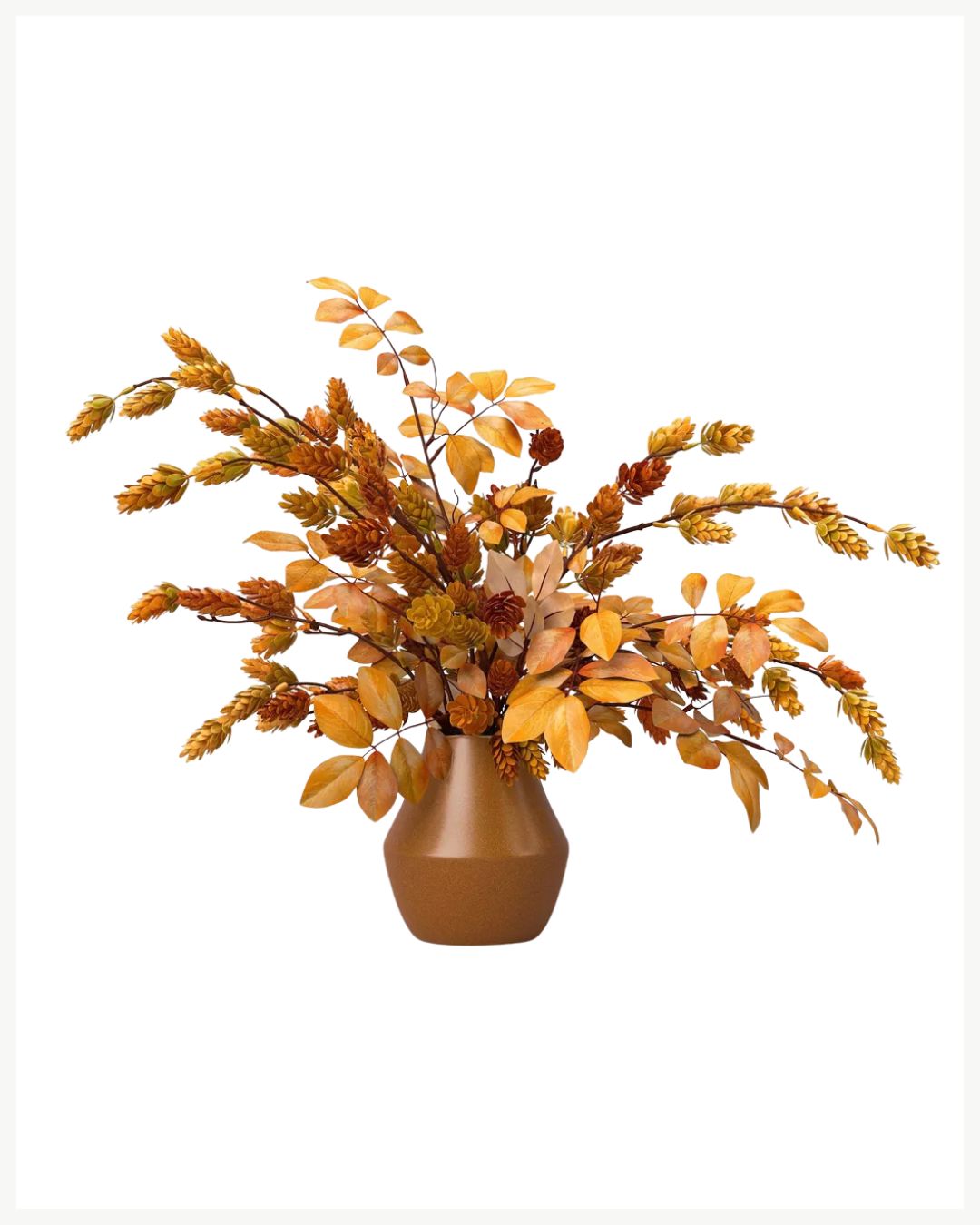 A brown geometric vase holds artificial autumn leaves and wheat stalks in orange, yellow, and brown, creating a fall-inspired decorative display—perfect for cozy living room decor ideas.