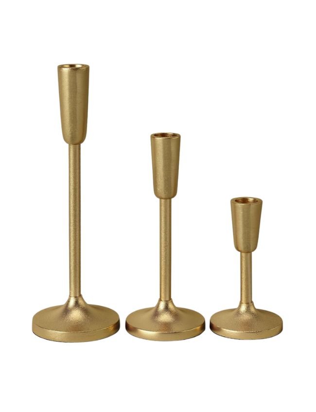 Three gold-colored candle holders of varying heights are arranged in a line, perfect for end-of-summer decorating ideas with hydrangea-inspired colors. Each holder has a sleek, cylindrical design with a flat, rounded base. The tallest is on the left, the medium-height one is in the middle, and the shortest is on the right.