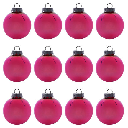 Twelve red Christmas ornaments, reminiscent of decoupage seashell creations, are arranged in a grid pattern. Each ornament features a silver cap and a small loop for hanging. The white background accentuates these holiday craft decorations, highlighting their festive charm.