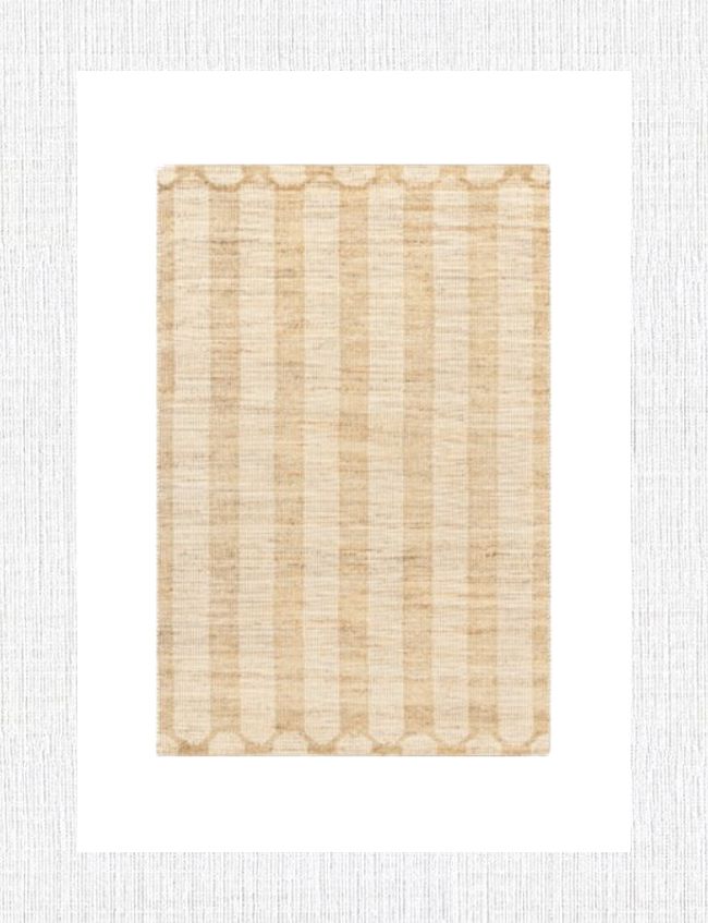 A rectangular woven rug with alternating light beige and tan vertical stripes, set against a white background, perfect for entryway decor. The edges feature a subtle patterned border, ideal for adding a touch of elegance to your foyer styling.