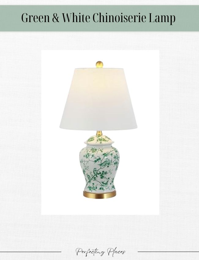 A green and white chinoiserie lamp with a floral pattern offers a timeless look, featuring a white fabric shade and a brass base. Perfectly suited for your Amazon Home Decor collection, it is displayed elegantly on a plain white background.