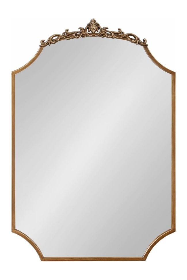 Rectangular mirror with beveled edges and an ornate, gold decorative frame at the top—perfect for a timeless living room styled with green and beige accents or to build around a rug for added elegance.