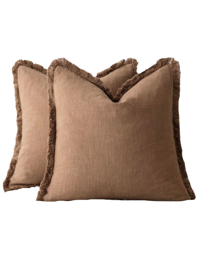 Two square brown throw pillows with a textured fabric and fringed edges, overlapping each other against a white background—perfect for adding classic cozy living room decor to your space.