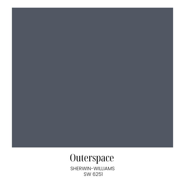 A solid square of dark grayish-blue, perfect for classic cozy living room decor, labeled "Outerspace" by Sherwin-Williams, SW 6251, with the name and code displayed below the color sample.